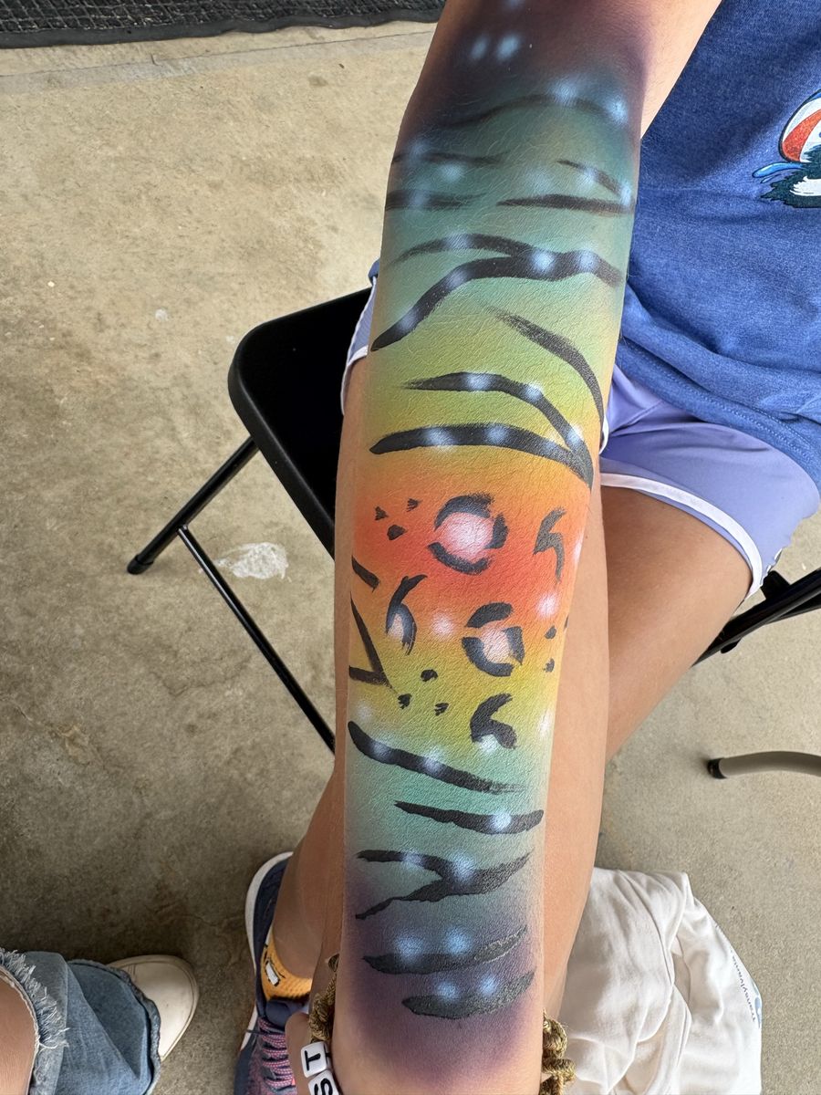 Airbrushed rainbow gradient arm sleeve with black leopard spots and tiger stripes